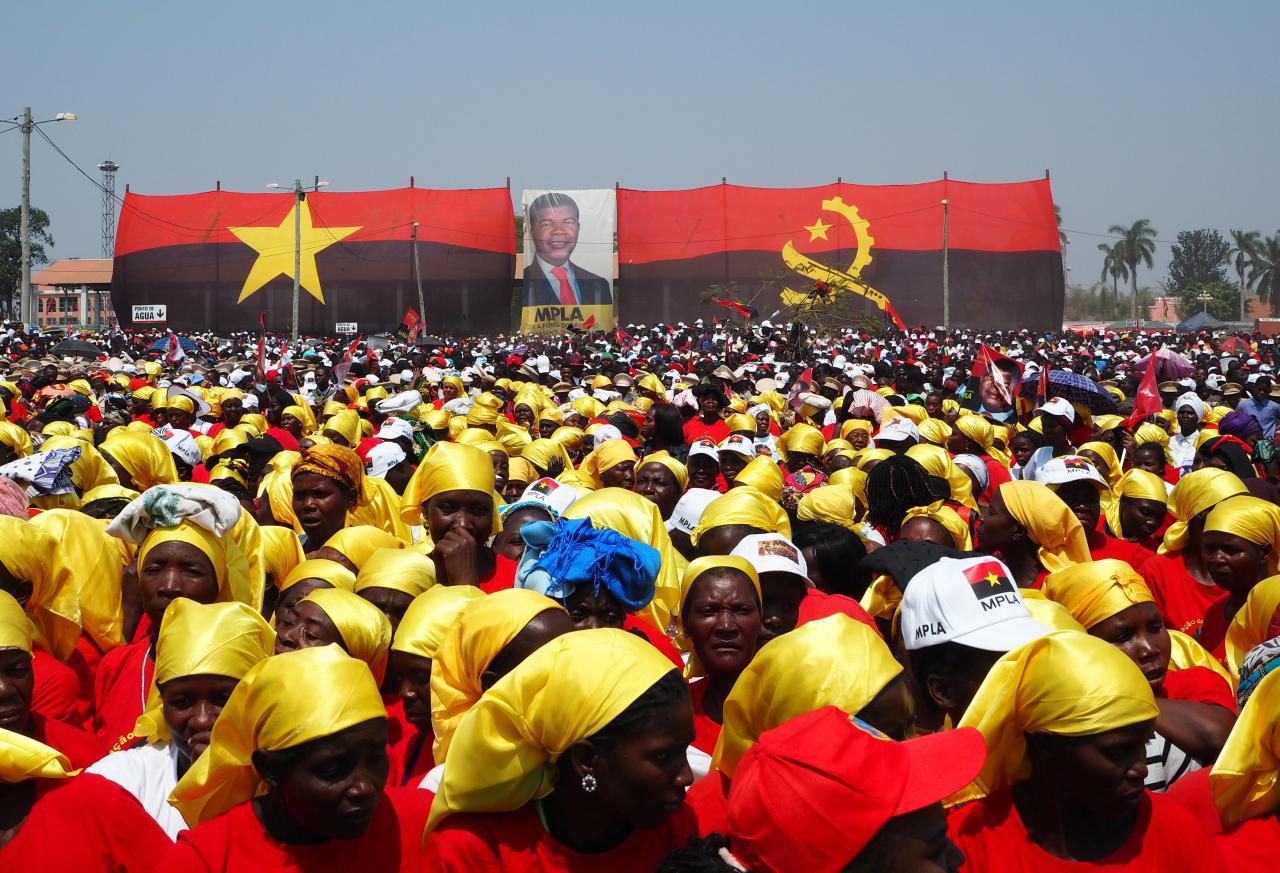 Supporters listen as Joao Lourenco, presidential candidate for the ruling MPLA party, speaks at an election rally in Malanje, Angola