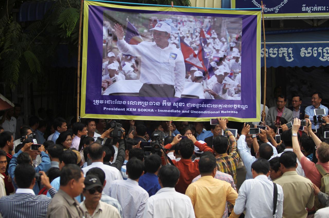 A banner of opposition leader and President of the Cambodia National Rescue Party (CNRP) Kem Sokha is seen during a news conference in Phnom Penh