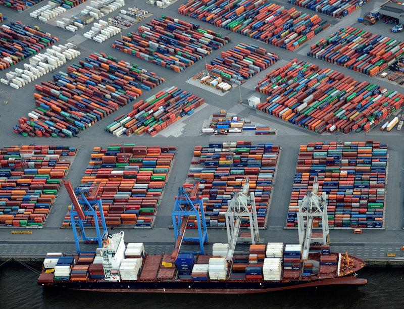 FILE PHOTO: A container ship is loaded at a terminal in the harbour of Hamburg