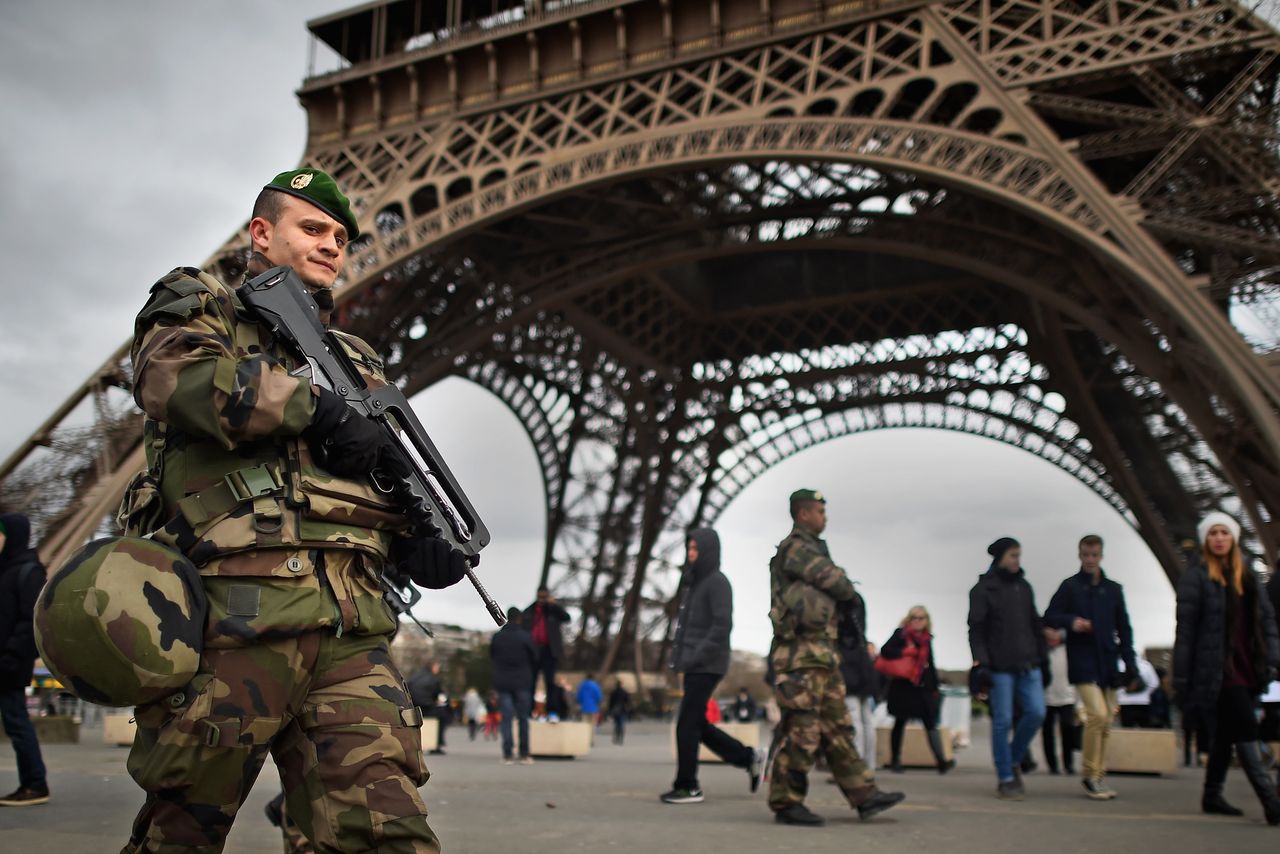 A French soldier stands guard in Paris as part of emergency law