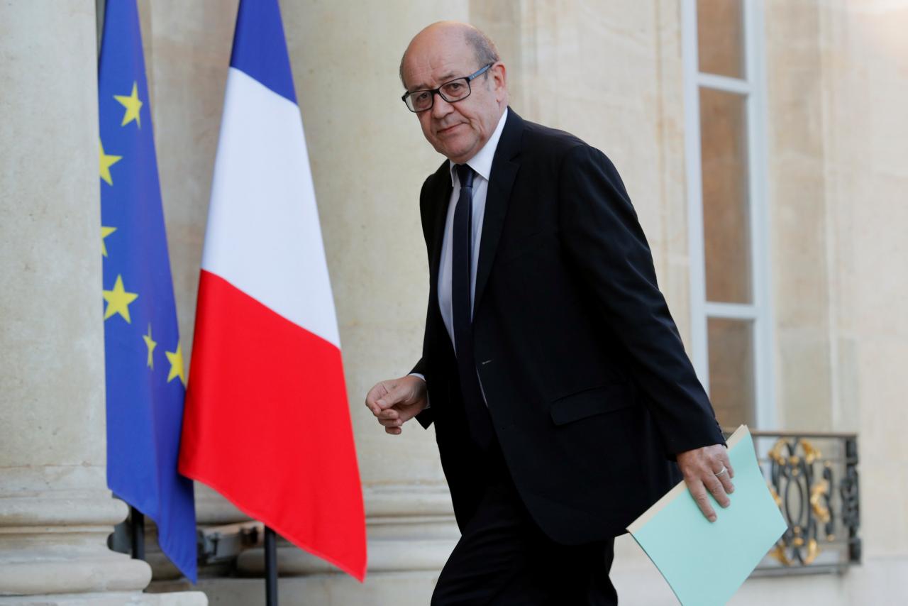 French Defence Minister Jean-Yves Le Drian arrives to attend a defence council at the Elysee Palace in Paris