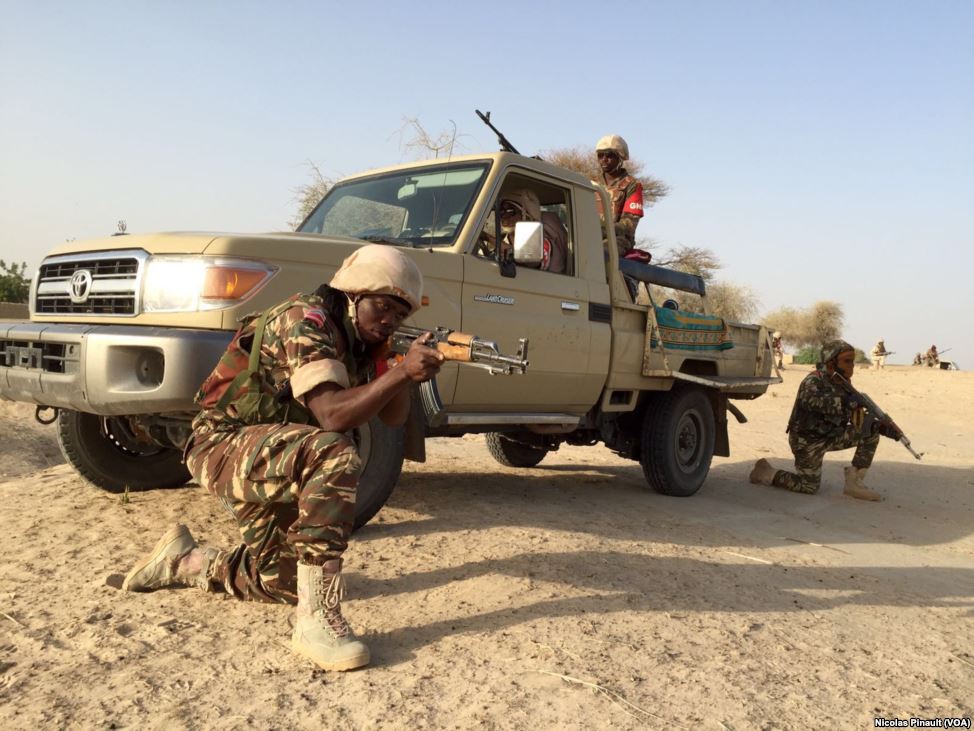 In the village of Zenam Kelouri, Nigerian soldiers conducting a show of force in their fight against Boko Haram on February 29, 2016. / ISIS returnees