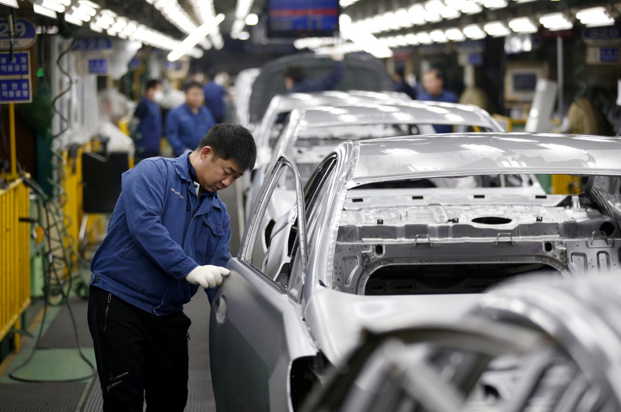 FILE PHOTO: A worker works at an assembly line of Hyundai Motor’s plant in Asan