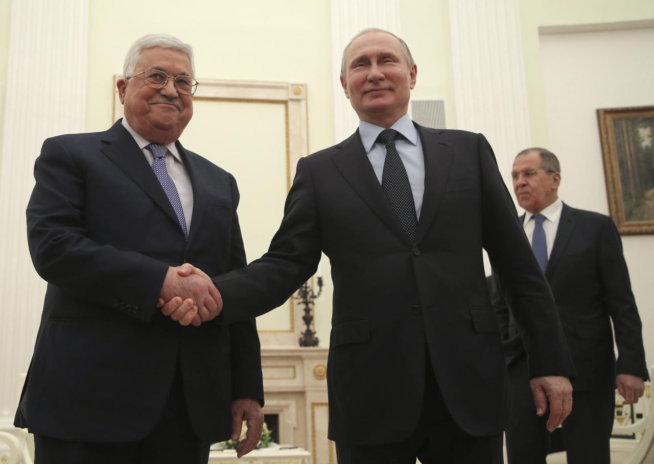 Russian President Putin, Foreign Minister Lavrov and Palestinian President Abbas attend a meeting in Moscow