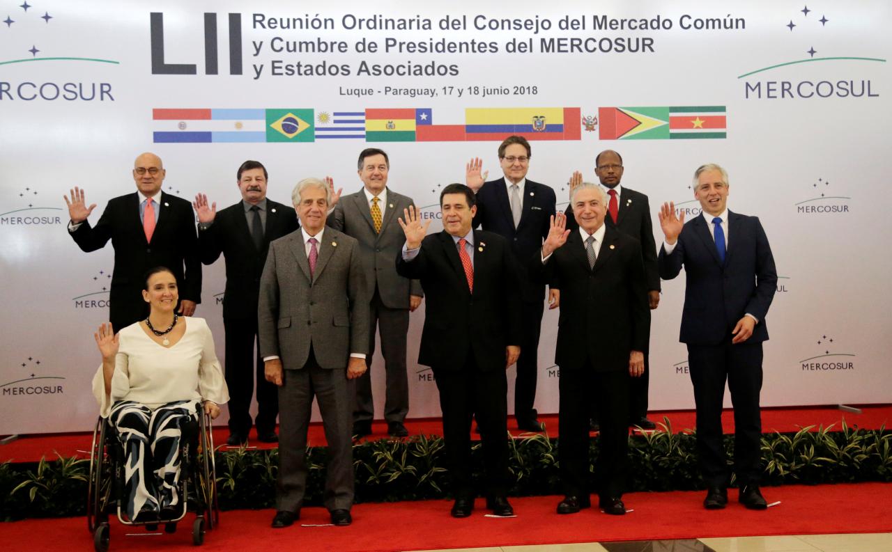 Leaders pose for an official photo at Mercosur trade bloc annual summit in Luque