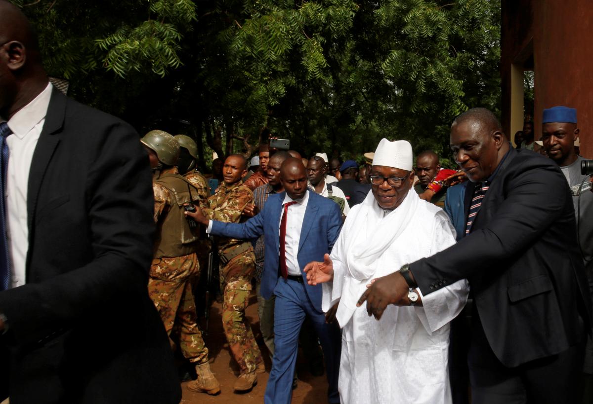 Ibrahim Boubacar Keita, President of Mali and candidate for Rally for Mali party (RPM) walks after casting his vote during the presidential election, at a polling station in Bamako