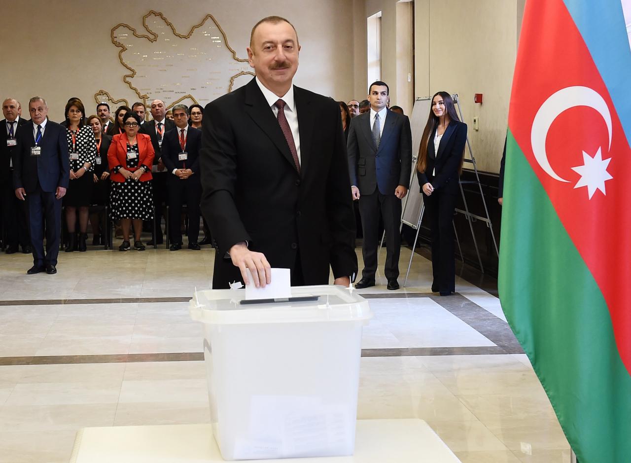 Azerbaijan’s President Aliyev casts his vote during the presidential election in Baku