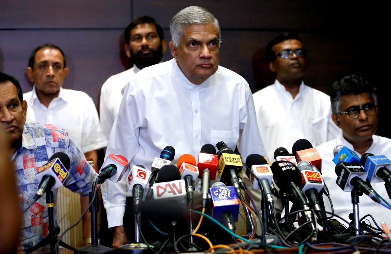Sri Lanka’s ousted Prime Minister Wickremesinghe arrives at a news conference in Colombo