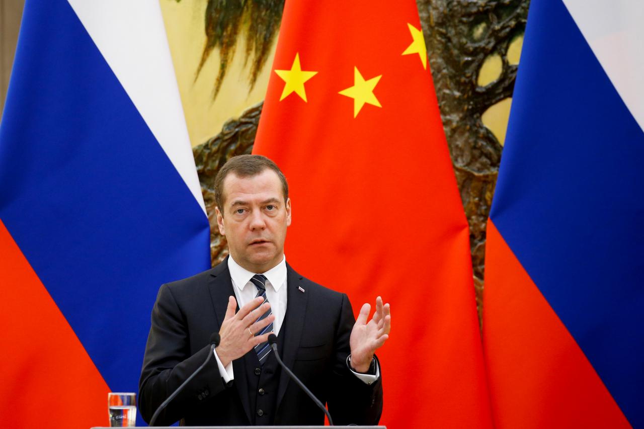 Russian Prime Minister Dmitry Medvedev speaks during a news conference after talks with Chinese Premier Li Keqiang at the Great Hall of the People in Beijing