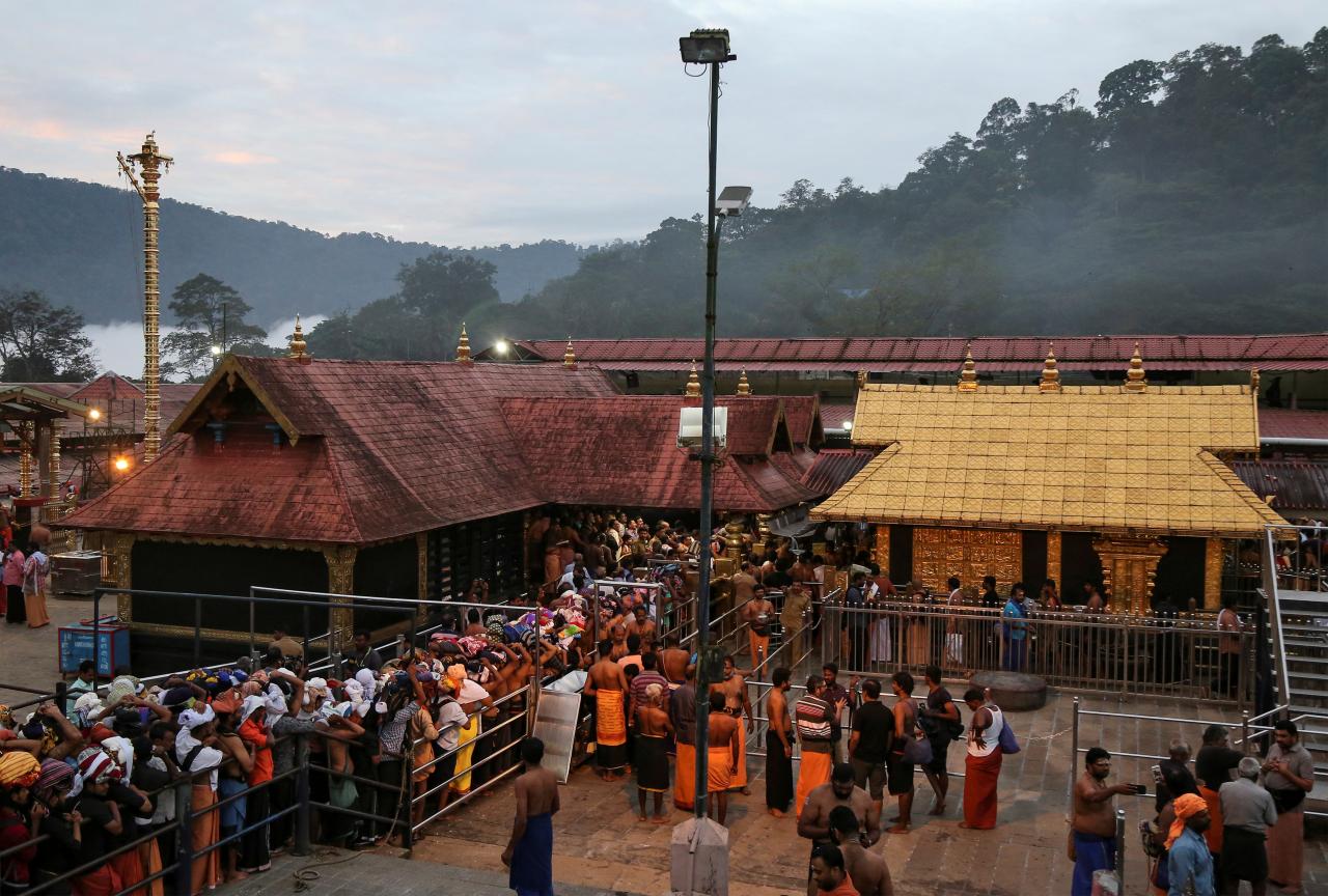 FILE PHOTO: Hindu devotees wait in queues inside the premises of the Sabarimala temple in Pathanamthitta