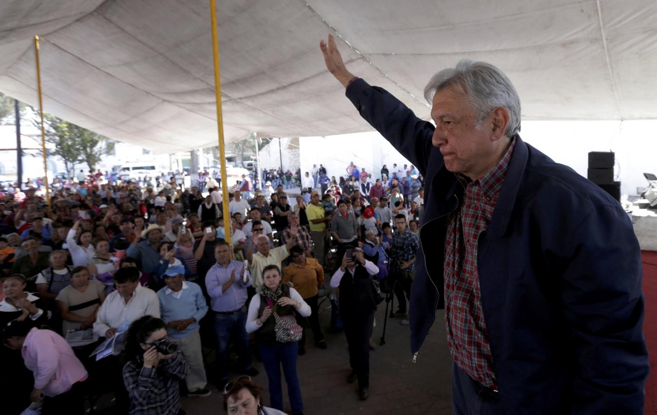 FILE PHOTO – MORENA party leader Obrador waves after giving a speech to supporters in Tlapanoloya